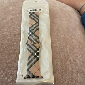 Apple Watch Band - size 38mm small. In a tan plaid pattern. Never used